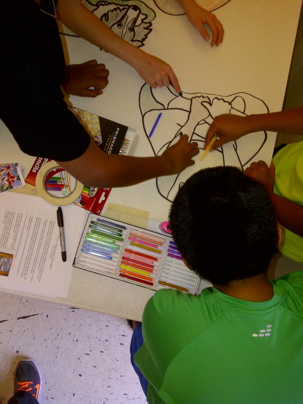 Children from Sunshine Camp volunteer at Micah 6 food pantry and help color the Panel 3 design for The Feeding of the 5000, a mosaic wall mural designed by Lynn Bridge and created by friends and members of University Presbyterian Church in Austin, Texas, U.S.A.